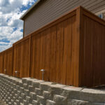 Wood,Fence,Cement,Stack,Stone,Blocks,Retaining,Wall,And,Landscaping