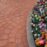 Artificial,Colorful,Flowers,In,Row,Flowerpot,With,Stamp,Concrete,To