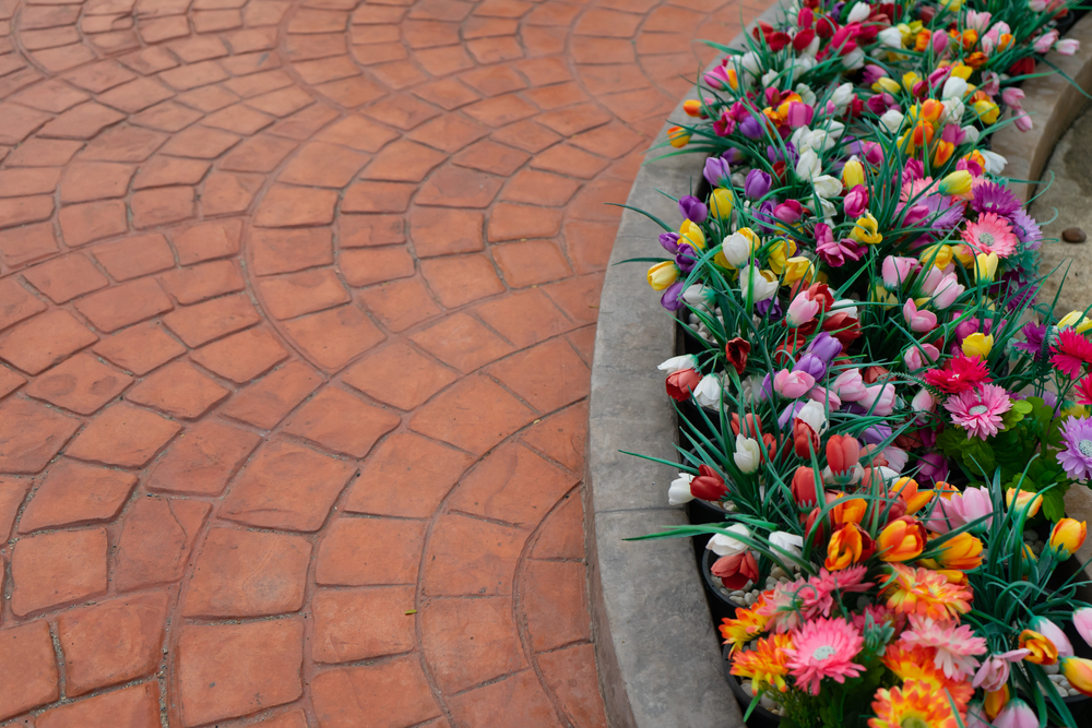 Artificial,Colorful,Flowers,In,Row,Flowerpot,With,Stamp,Concrete,To